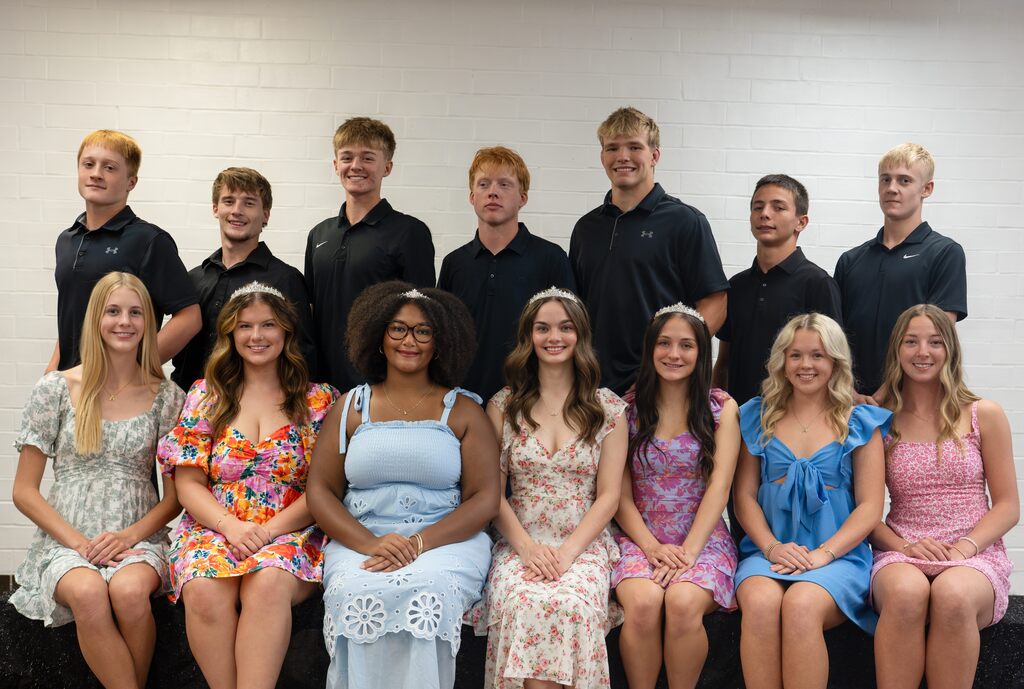 All 14 Homecoming candidates posting for a group photo with the guys standing behind the girls sitting