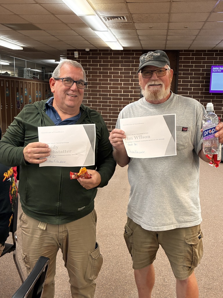 Randy Hochstatter and Tim Wilson receiving certificates of excellence.