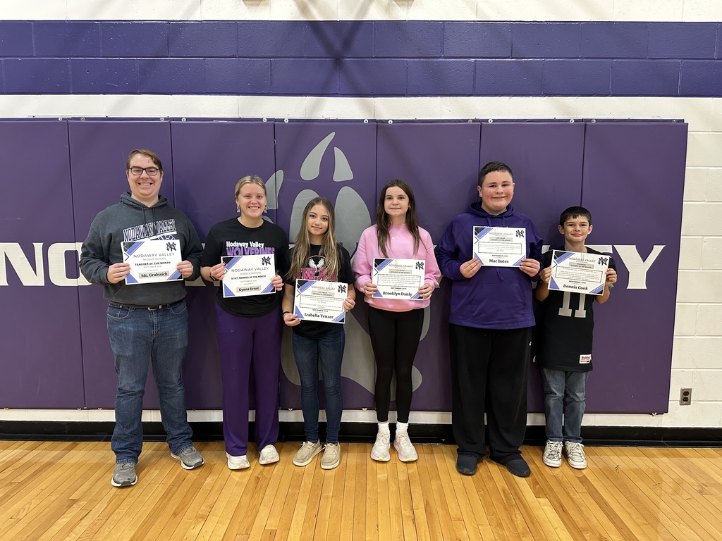 6 students holding their students of the month awards
