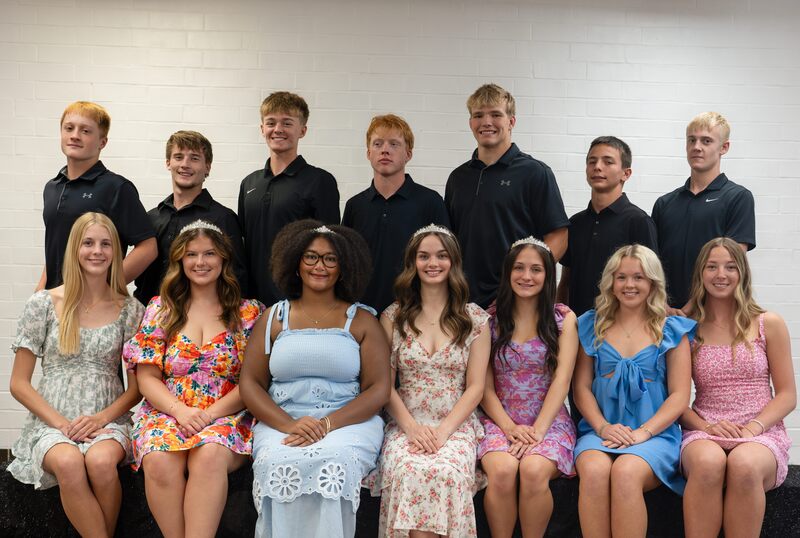 All 14 homecoming court members with boys standing in the back