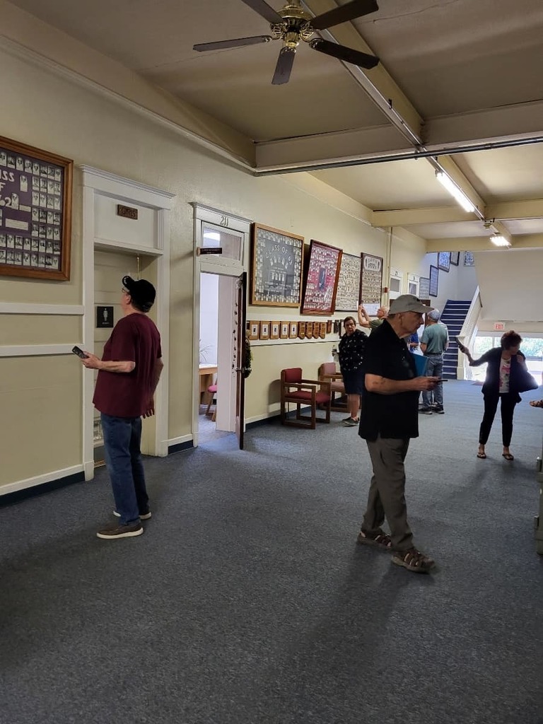 candid shot of alumni in district office