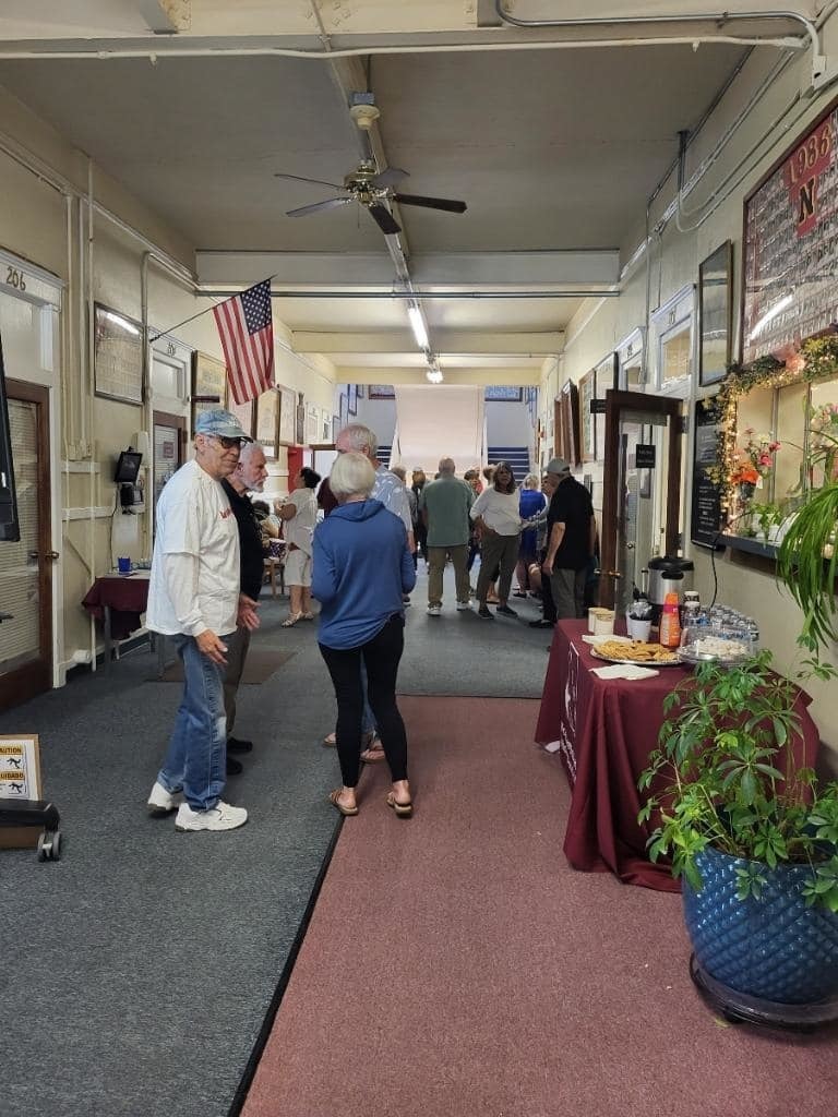 candid shot of alumni in district office