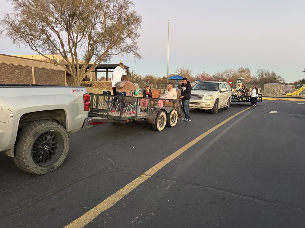 Various photos of Kennedy Elementary caroling.