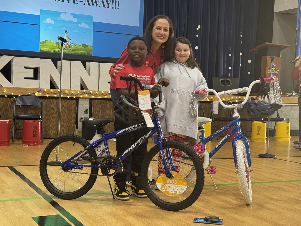 Various photos of Kennedy Elementary Kids getting a bike.