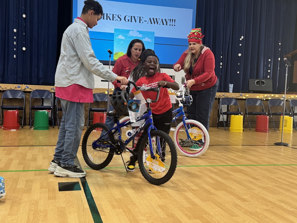 Various photos of Kennedy Elementary Kids getting a bike.