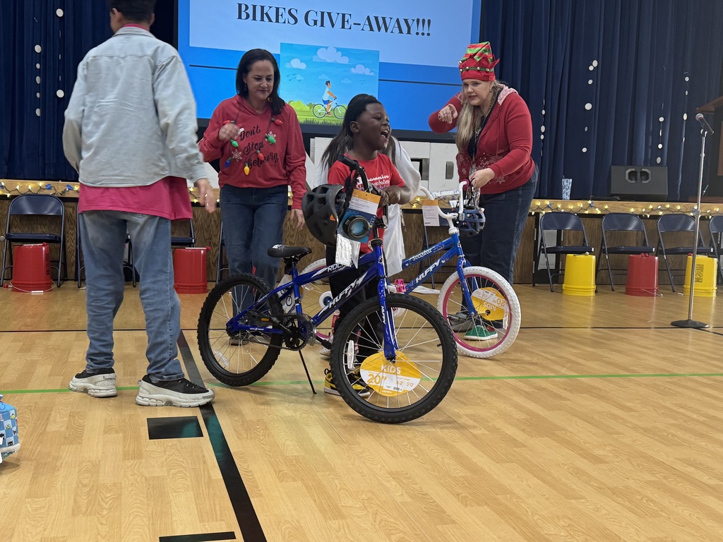 Various photos of Kennedy Elementary Kids getting a bike.