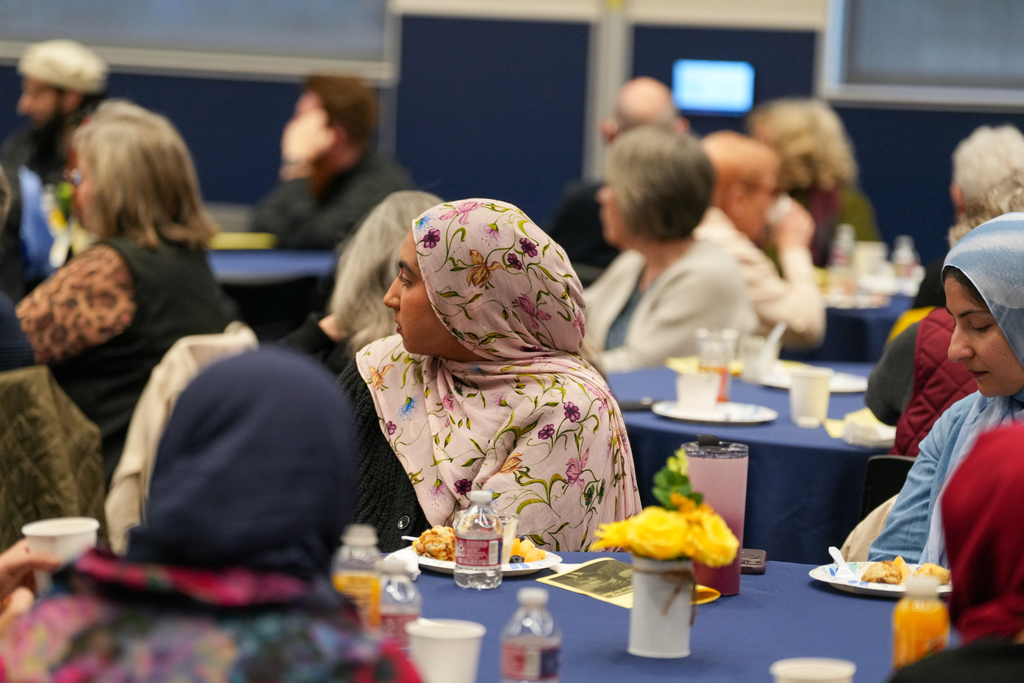 Various photos from the mayor's interfaith breakfast.