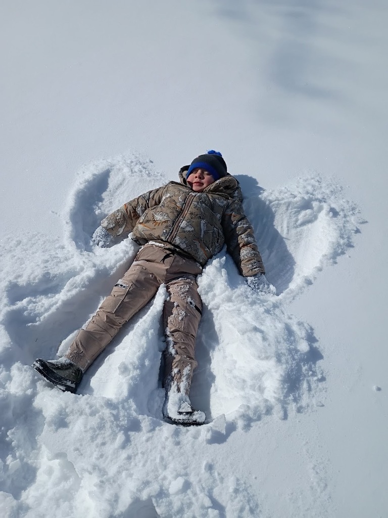 Various photos of NPS ELC Kids playing in the snow.