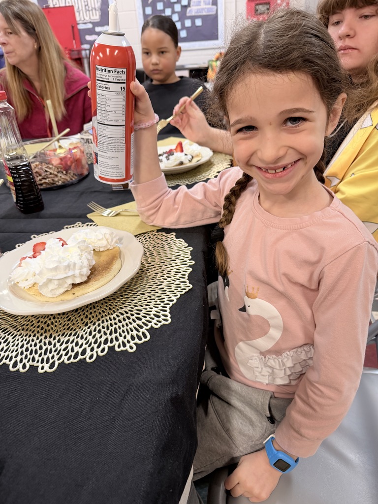 Various photos of Lakeview students having pancakes with the principal.