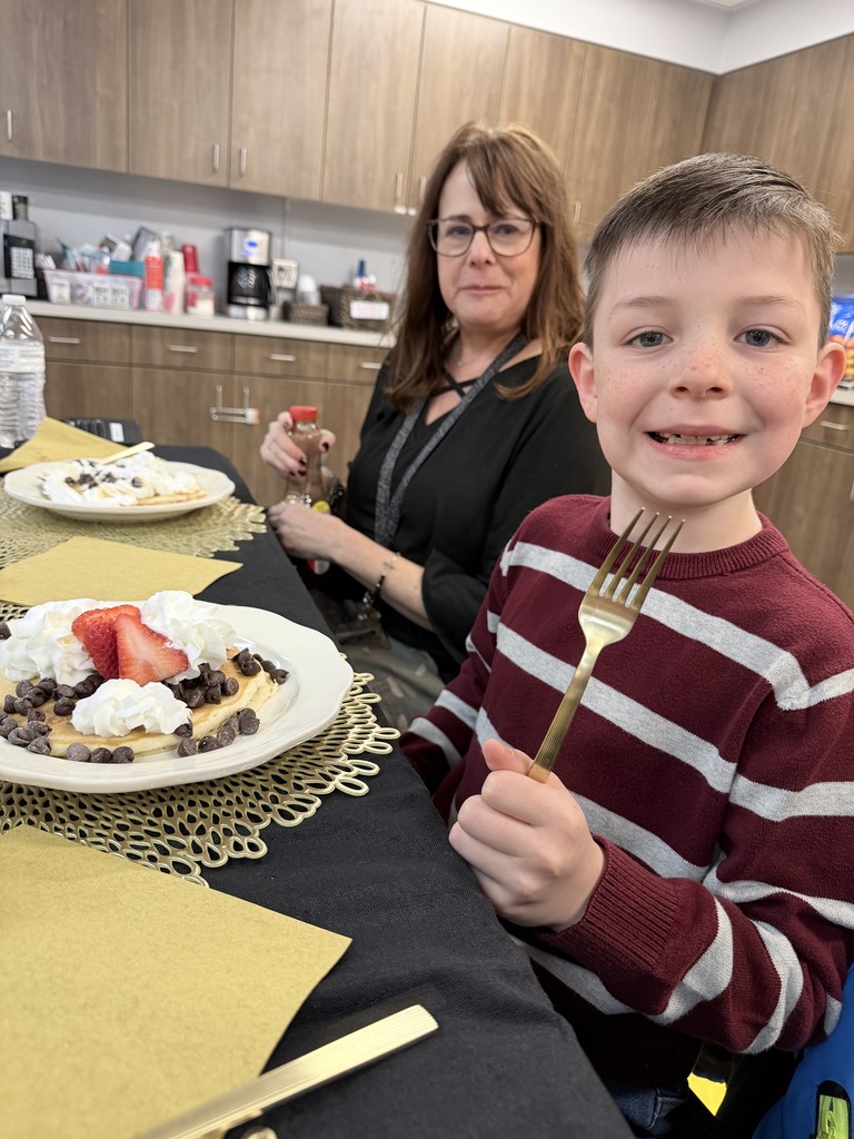 Various photos of Lakeview students having pancakes with the principal.