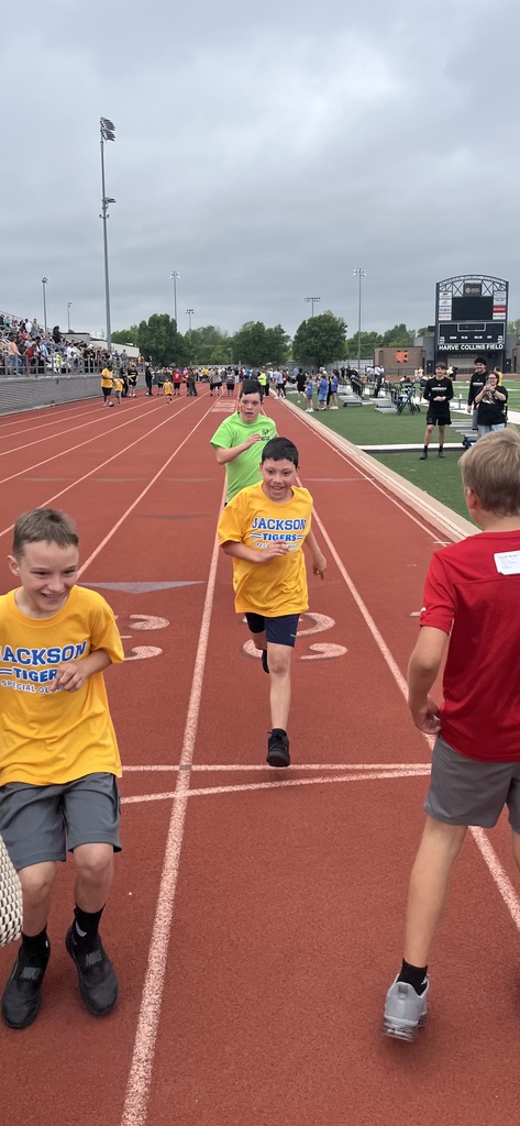 Various photos of NHS cheer helping with special olympics.