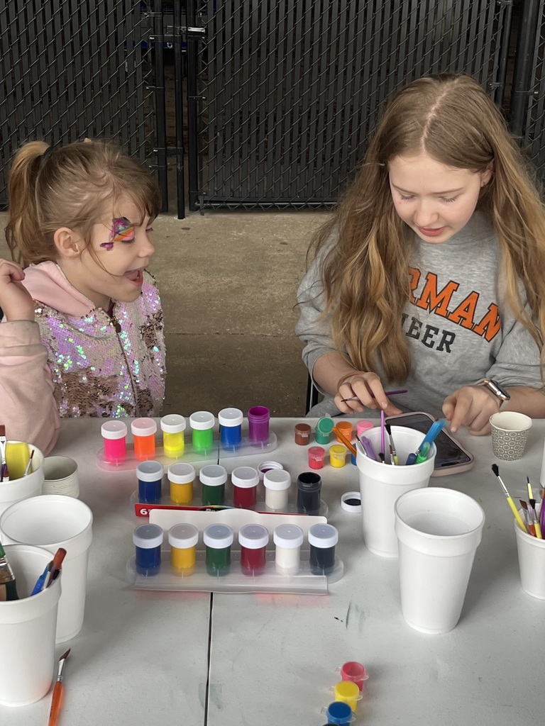 Various photos of NHS cheer helping with special olympics.