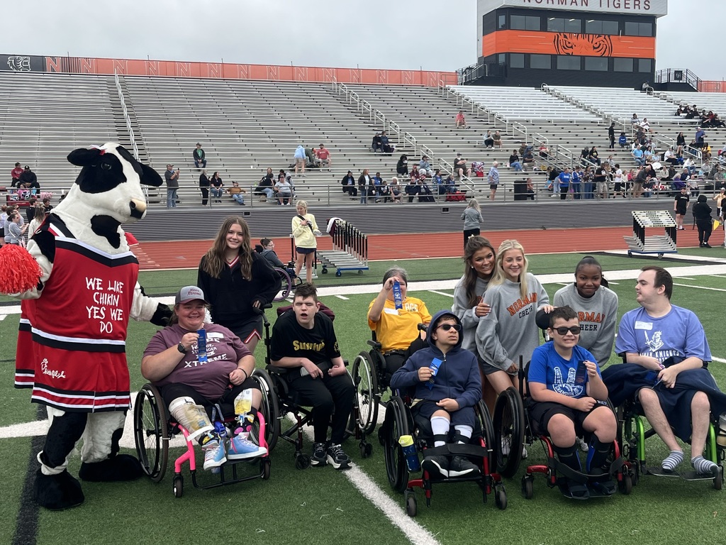Various photos of NHS cheer helping with special olympics.