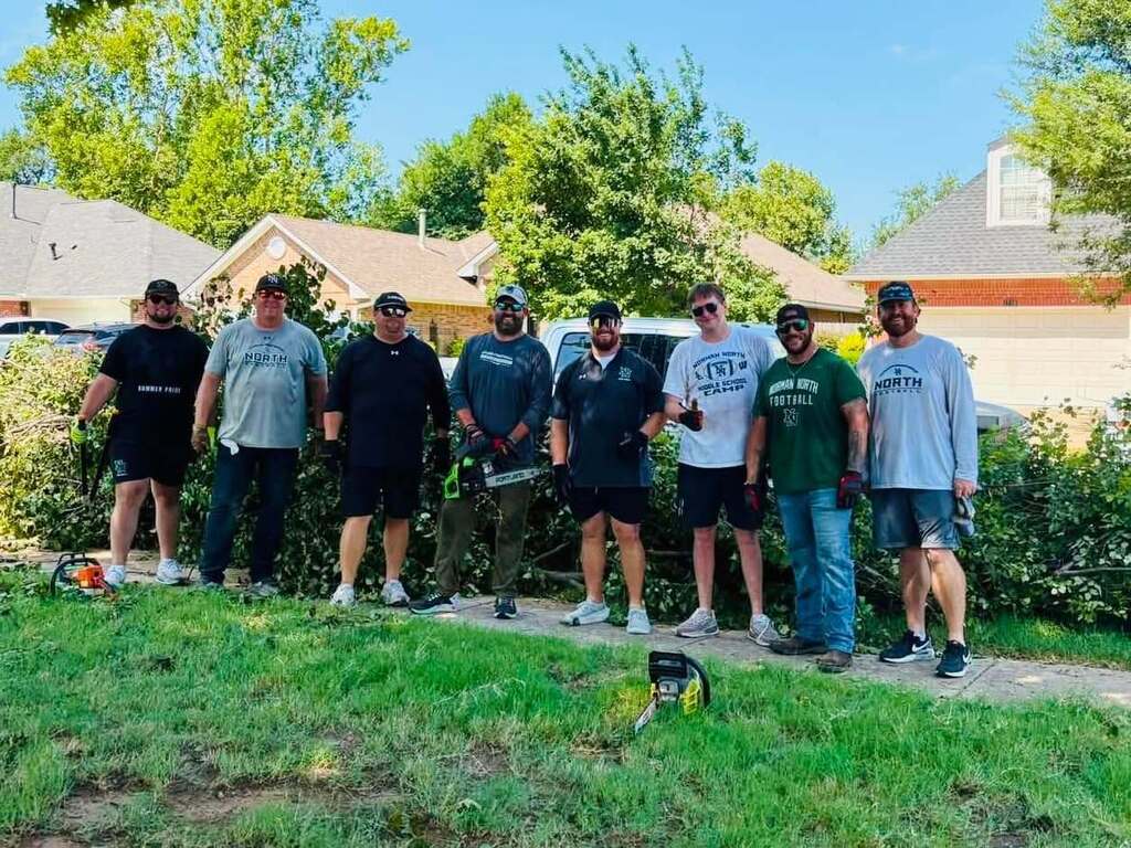 Various photos of Norman High football team helping clean up after storms.
