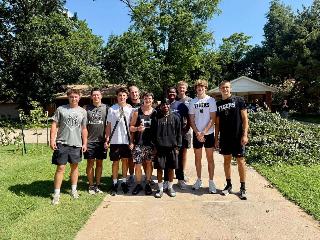 Various photos of Norman High football team helping clean up after storms.