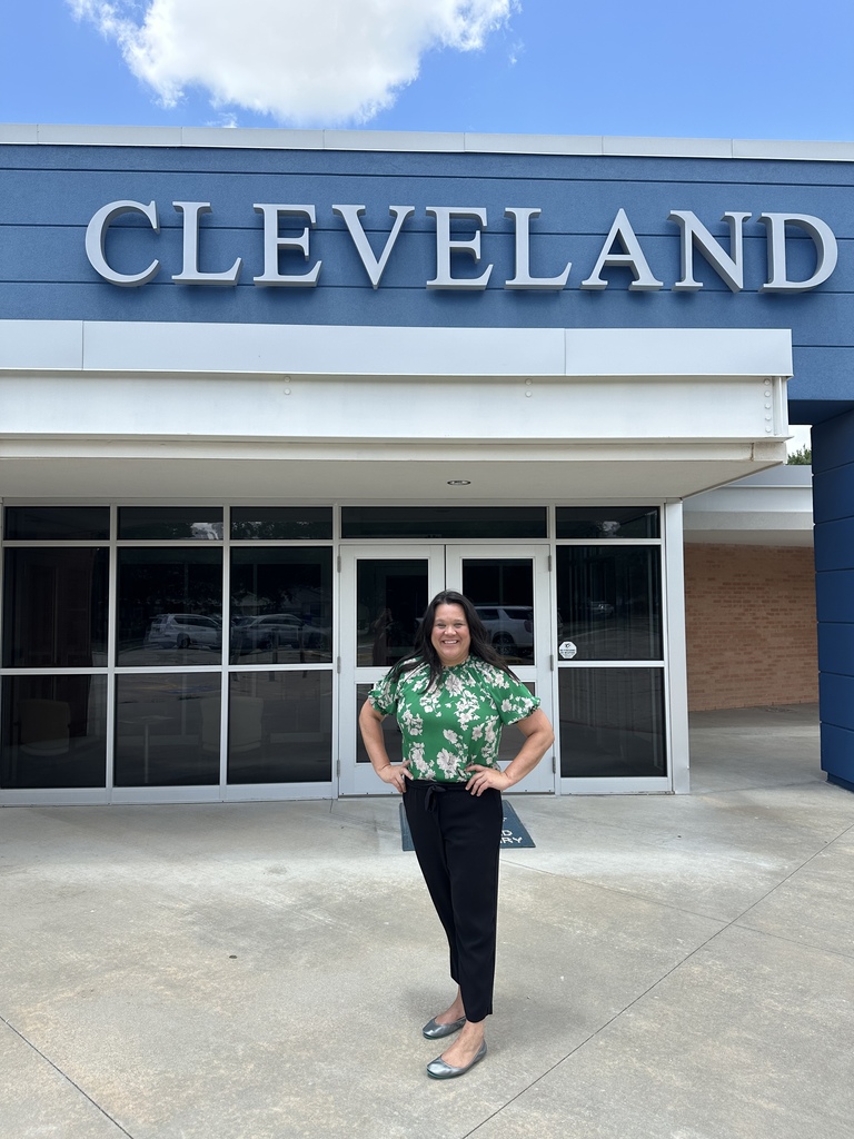 Jenny Crow standing in front of Cleveland Elementary