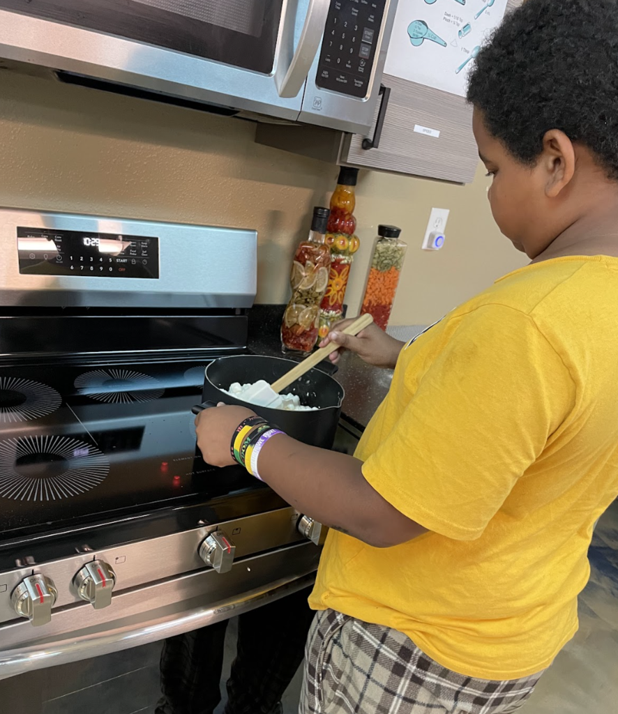 learner cooking on a stove top
