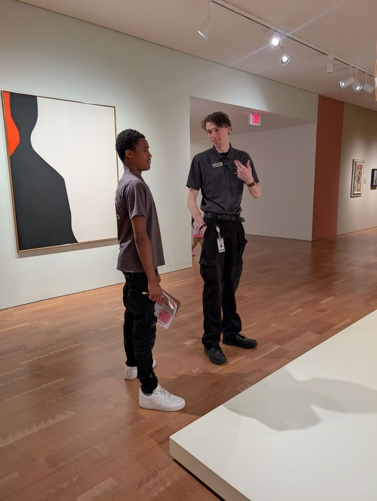 learner talking with museum guide