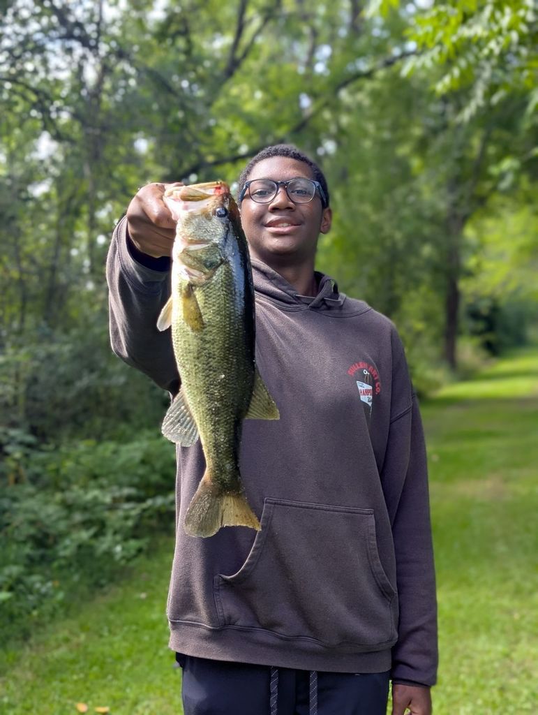 male learner holding a fish