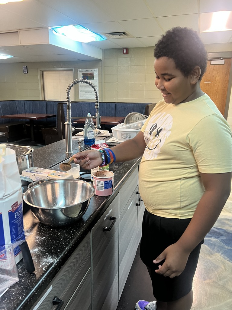 Learning making icing for his cake