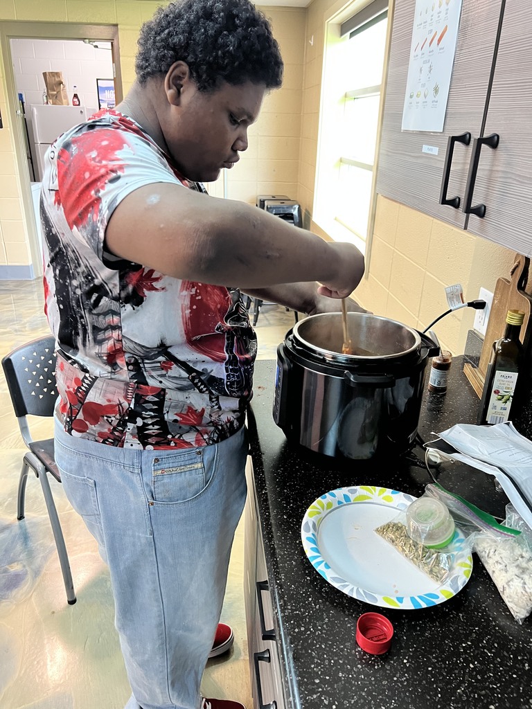 Learner stirring a pot
