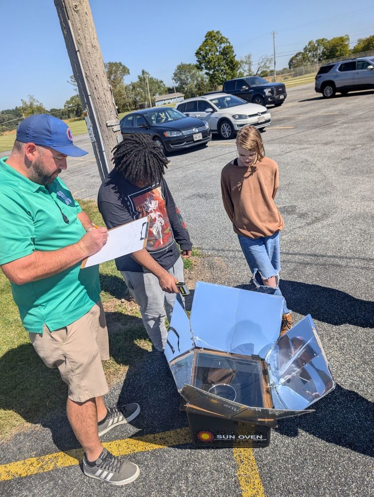 learners using a solar sun oven.