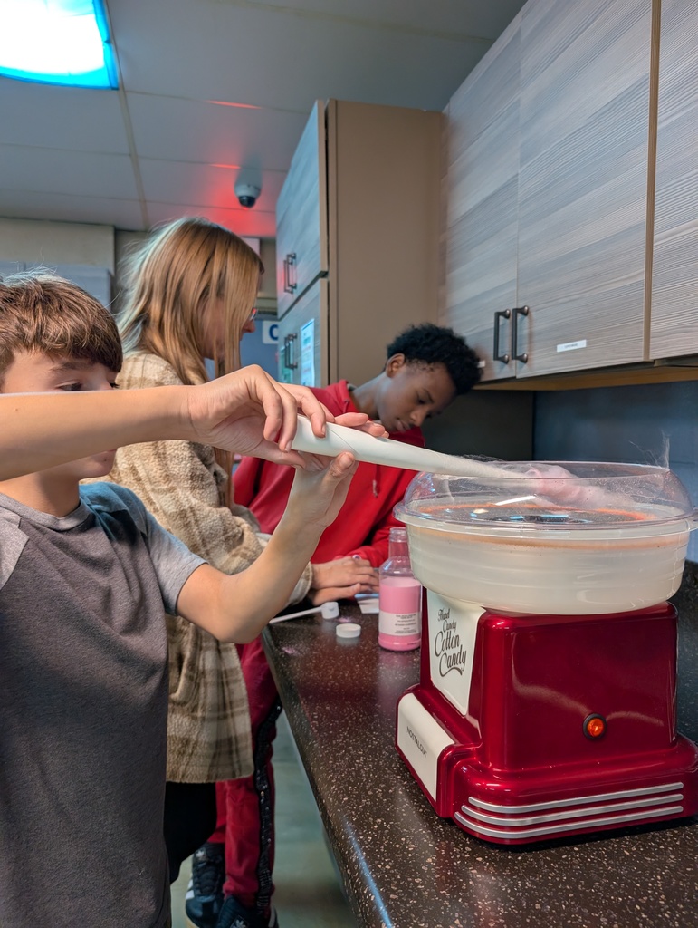 making cotton candy with staff and 2 learners