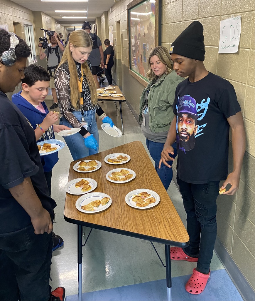 learners eating and serving grilled cheese