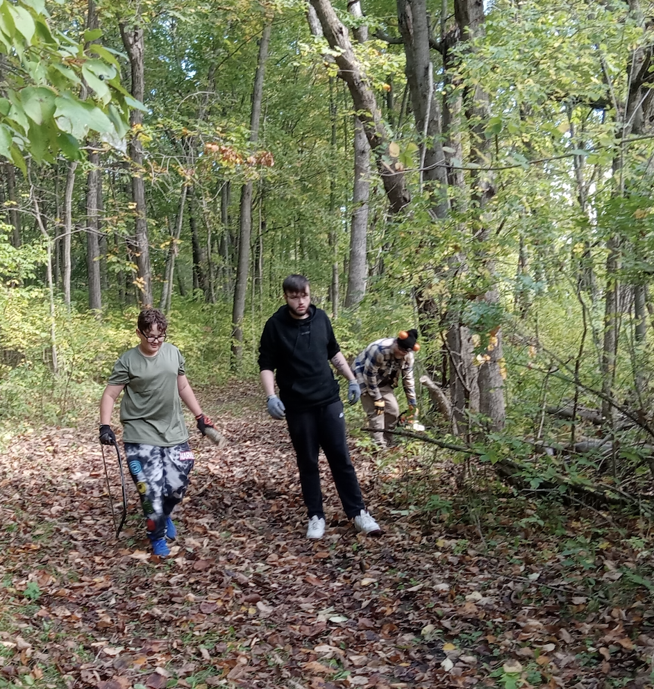 learners and staff clearing trails