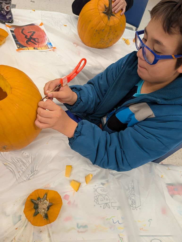 learner carving pumpkin