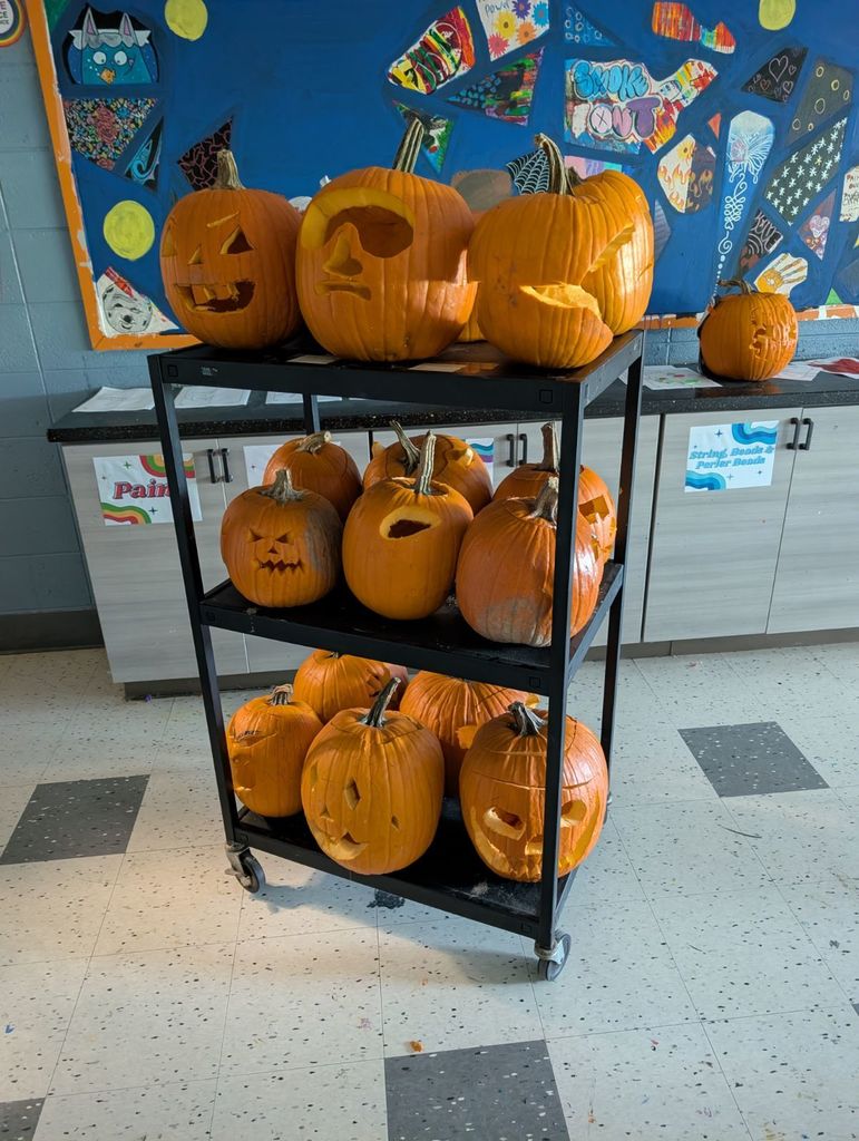 many completed carved pumpkins