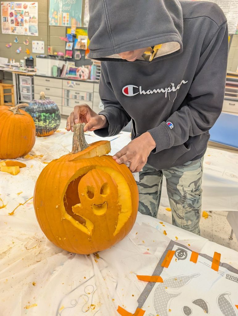 learner carving pumpkin