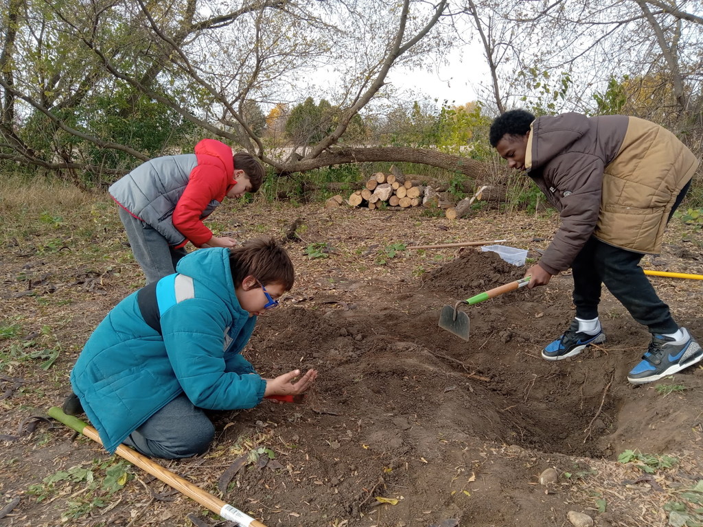 learners digging for bugs and worms