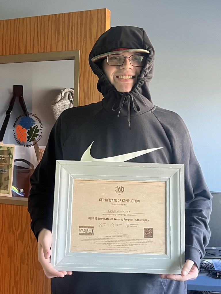 learner showcasing his certificate of achievement