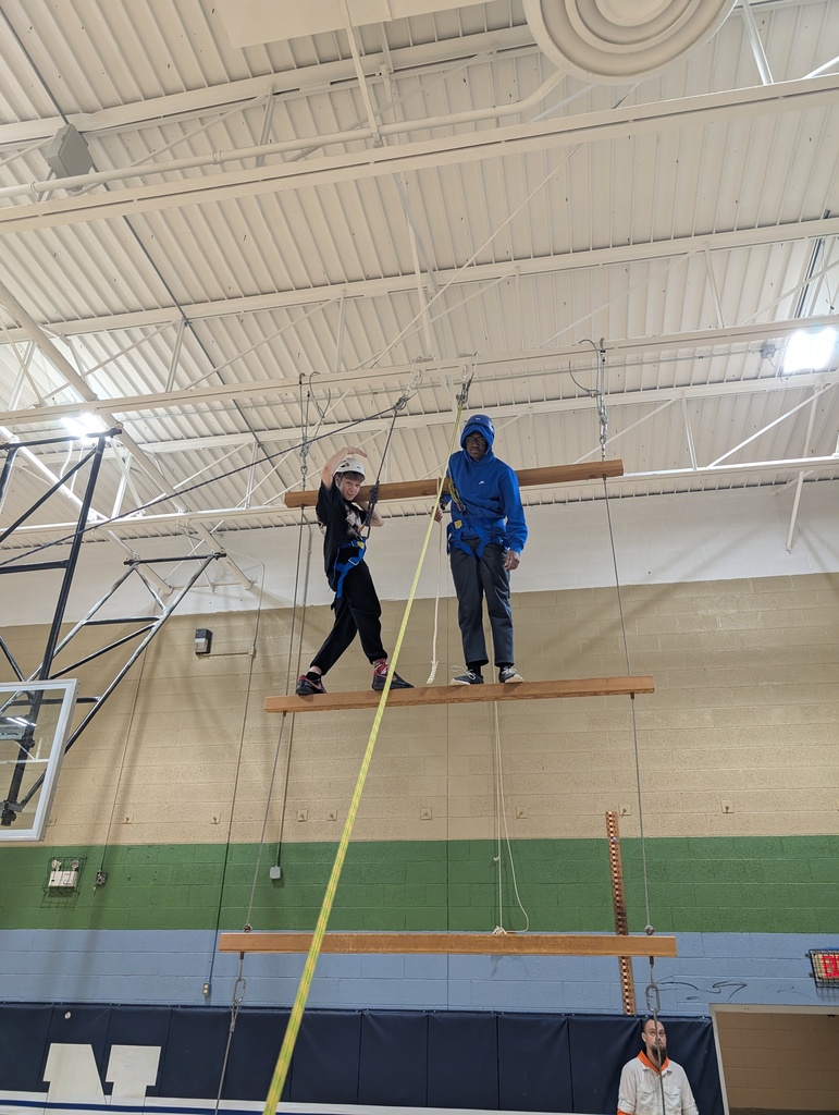 two young males on indoor ropes course
