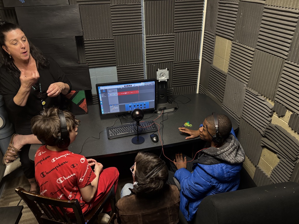 3 learners working on a podcast