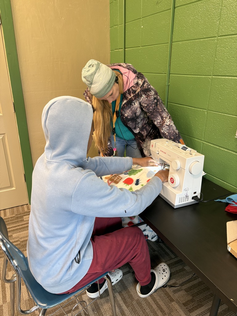 male learner sweing