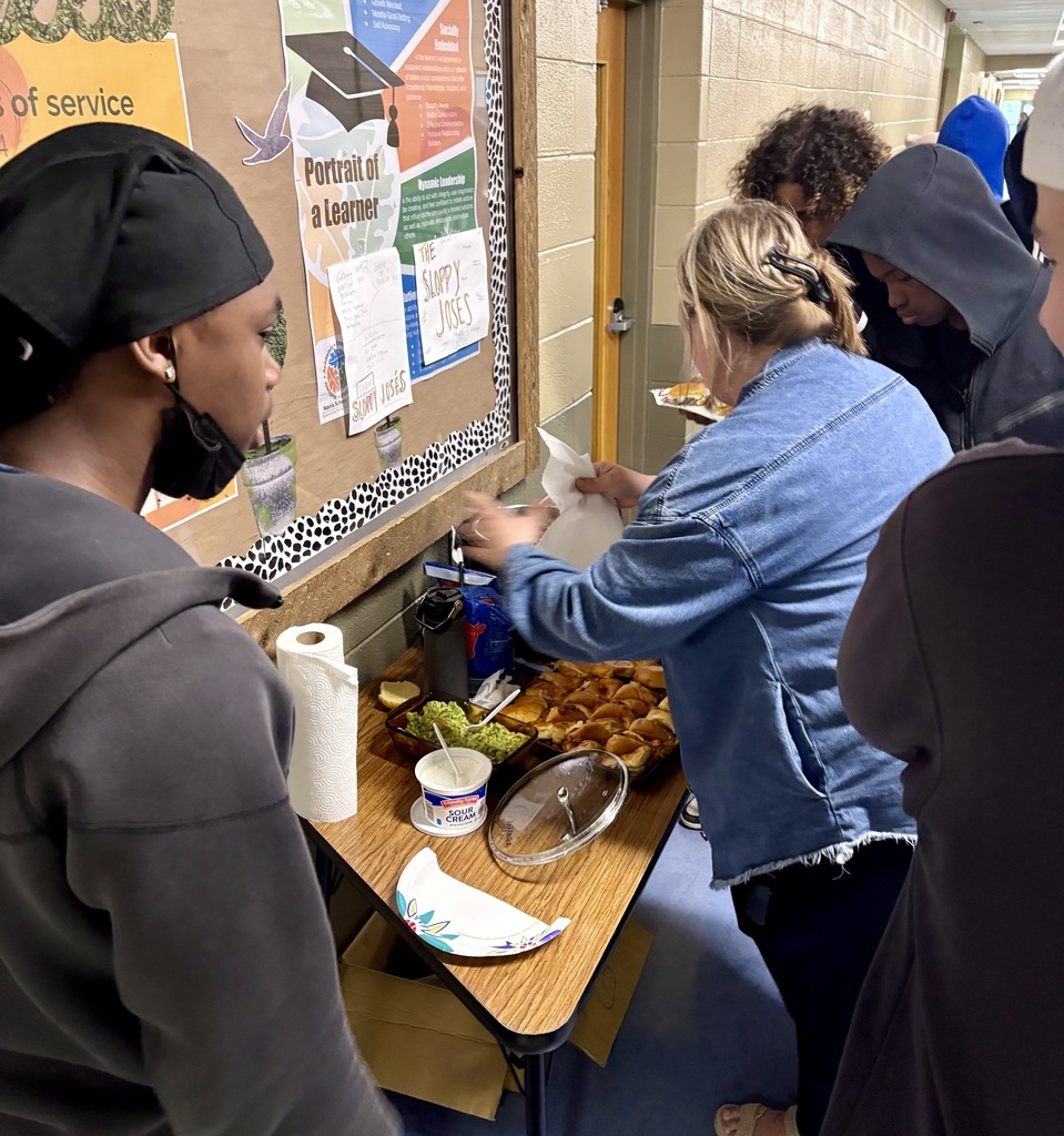 staff and learners making sloppy joe sandwiches