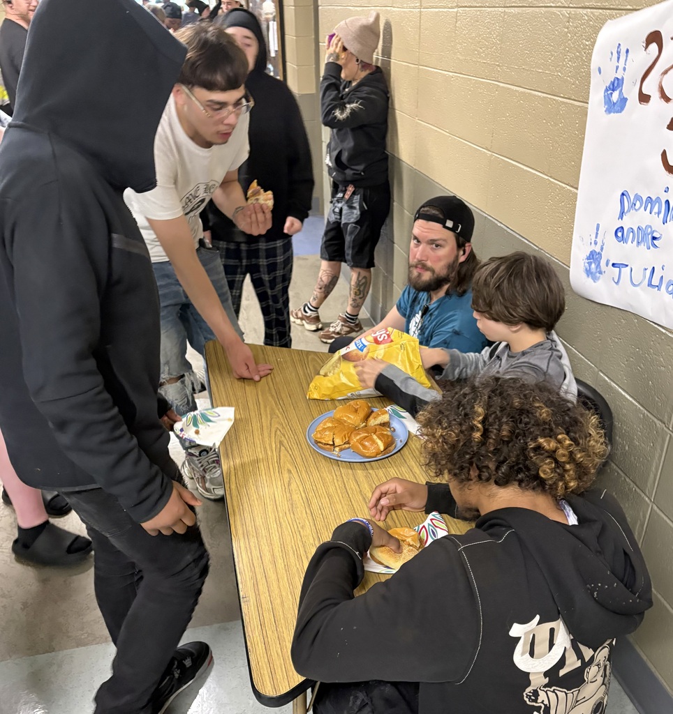learners serving and eating sandwiches