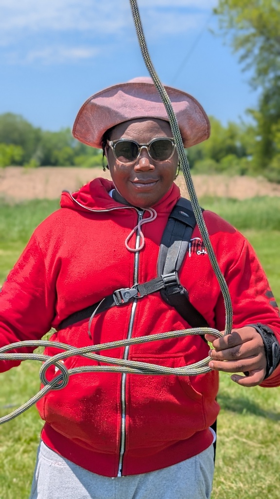 learner helping with ropes on the zip line