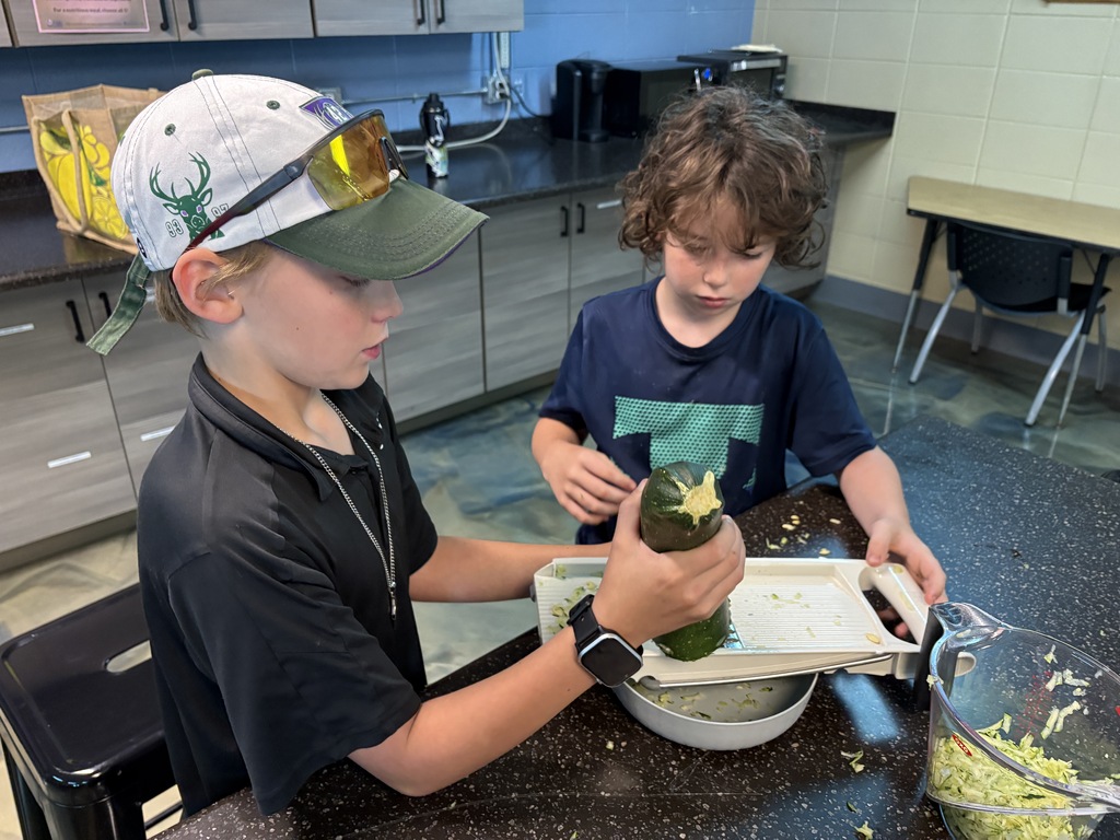 learners peeling a zucchini