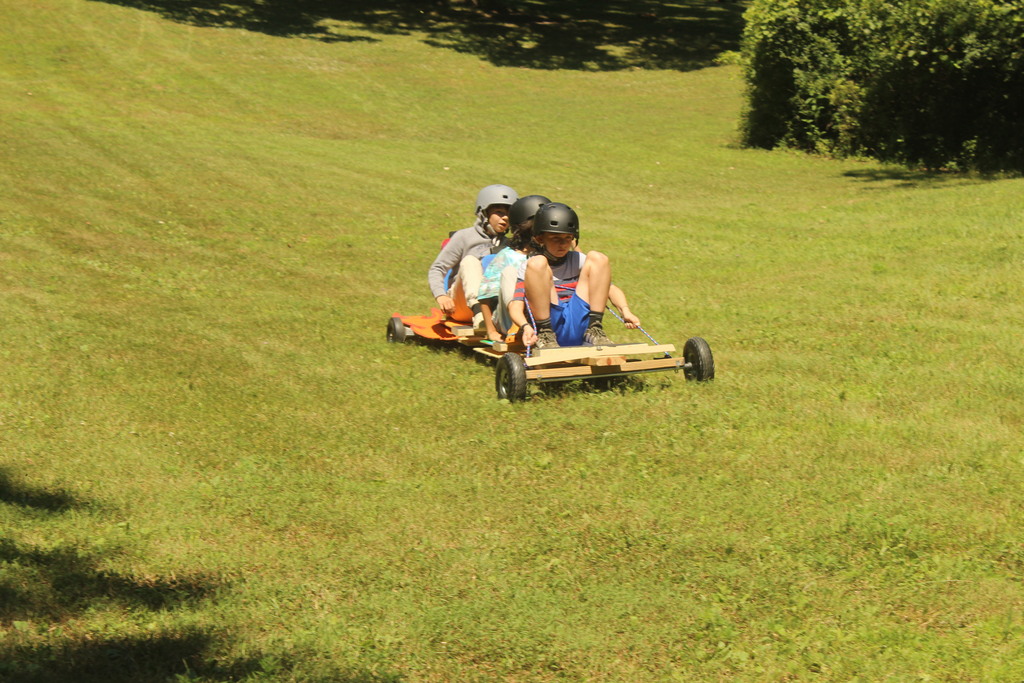3 learners driving a soapbox car