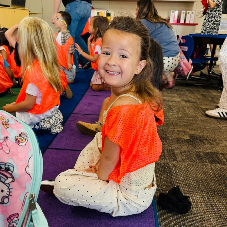 students and staff smiling on the first day of school