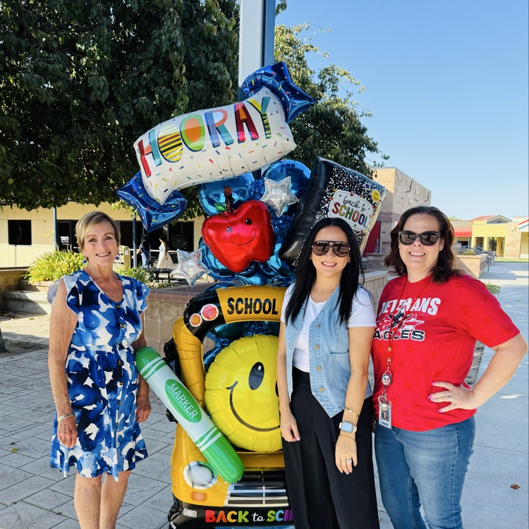 students and staff smiling on the first day of school