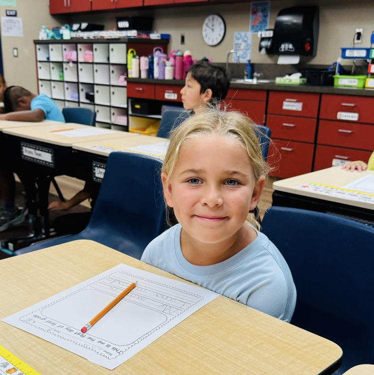 students and staff smiling on the first day of school