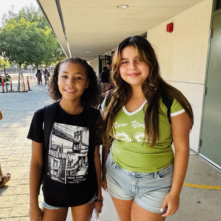 students and staff smiling on the first day of school