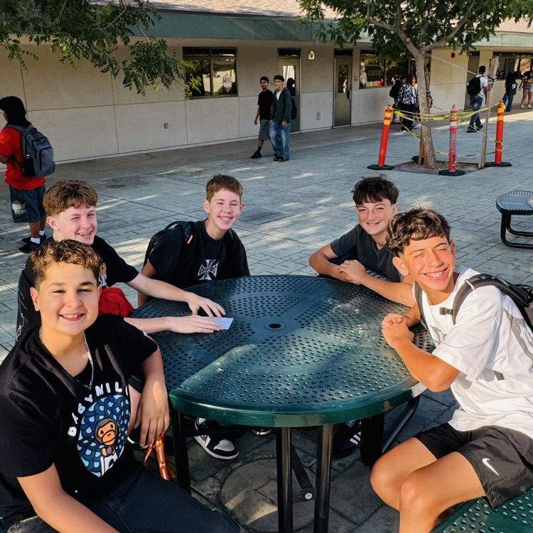 students and staff smiling on the first day of school