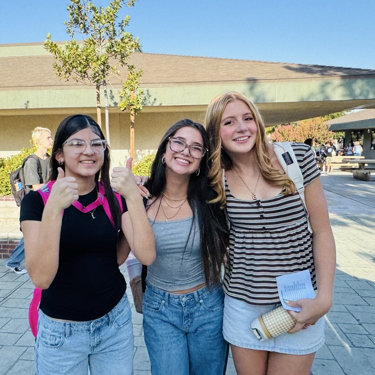 students and staff smiling on the first day of school