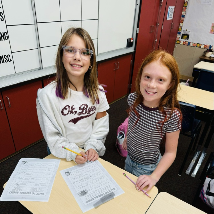 students and staff smiling on the first day of school