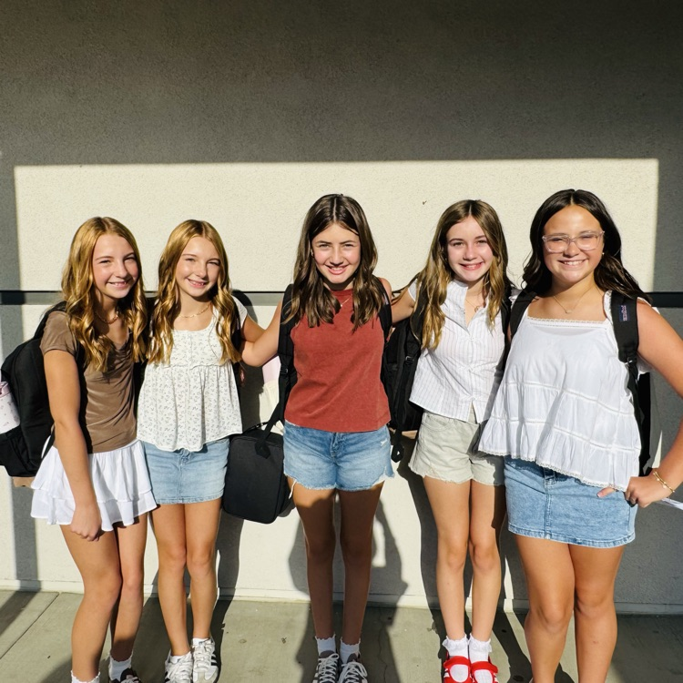 students and staff smiling on the first day of school